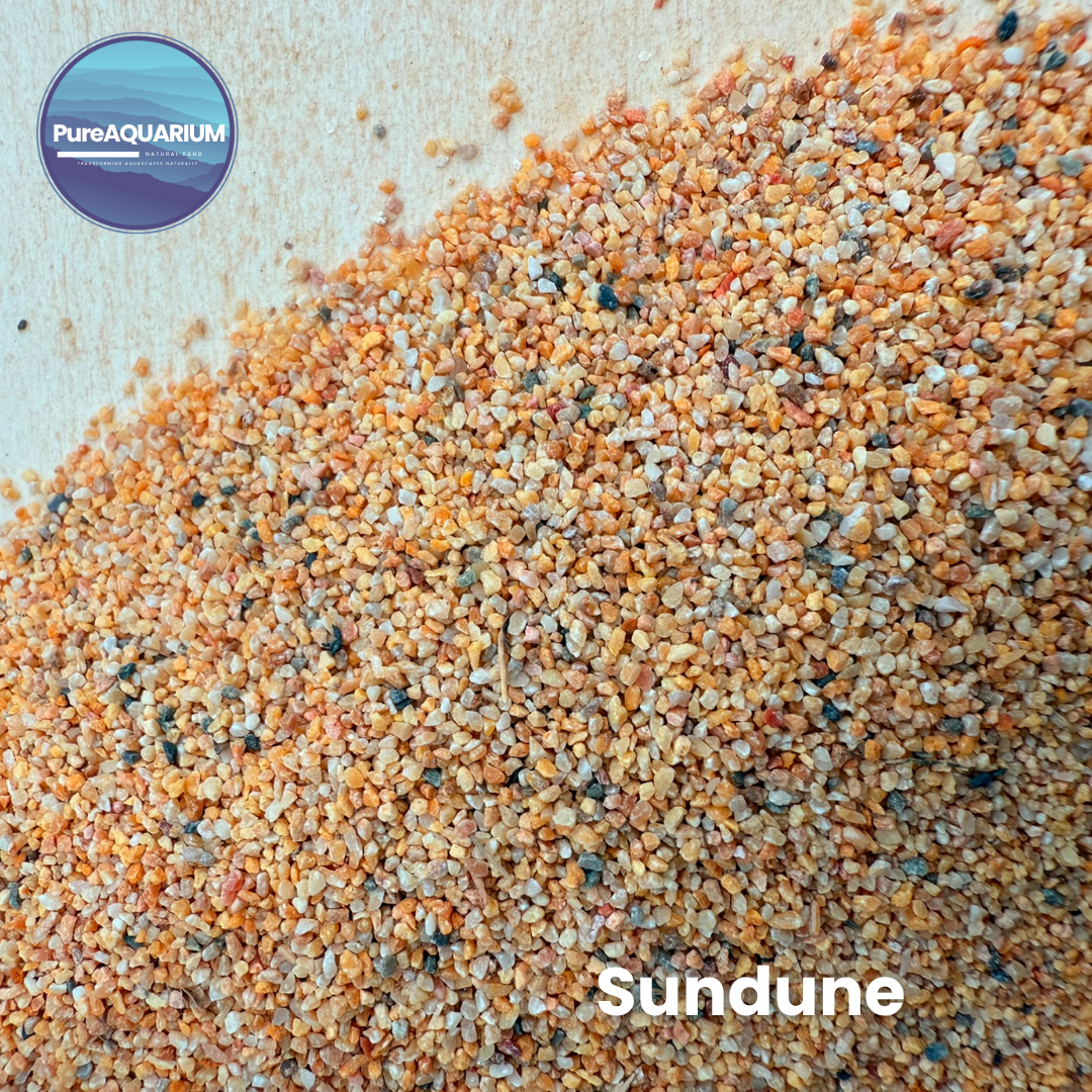 Gravel with a mix of orange, brown, and gray colors on a light background, branded as PureAquarium Sundune gravel.